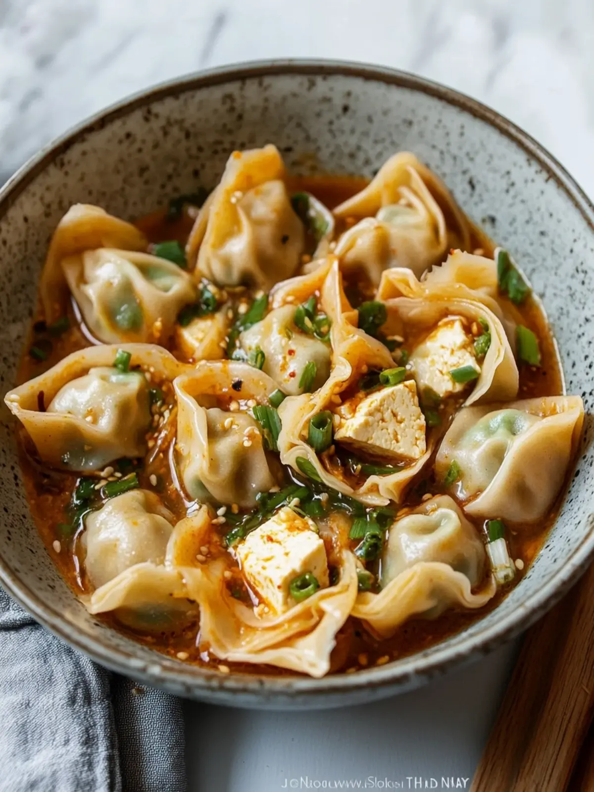 Savory Tofu and Chive Wontons in Chili Broth You'll Love 2 Tofu and Chive Wontons in Chili Broth